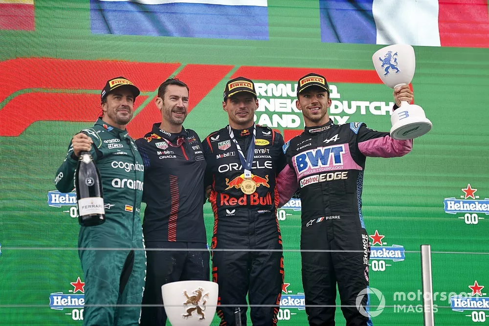 Fernando Alonso, Aston Martin F1 Team, 2nd position, the Red Bull trophy delegate, Max Verstappen, Red Bull Racing, 1st position, Pierre Gasly, Alpine F1 Team, 3rd position, on the podium