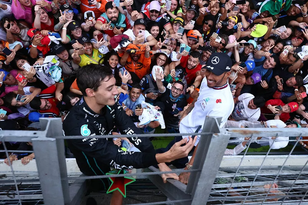 George Russell, Mercedes AMG, 1st position, Lewis Hamilton, Mercedes AMG, 2nd position, celebrate with fans after the race