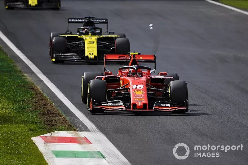 Charles Leclerc, Ferrari SF90, leads Daniel Ricciardo, Renault F1 Team R.S.19, and Nico Hulkenberg, Renault F1 Team R.S. 19