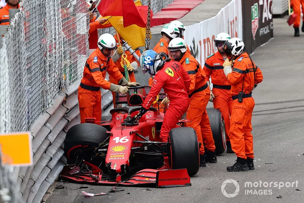Marshals assist Charles Leclerc, Ferrari SF21, after he crashes out of Qualifying
