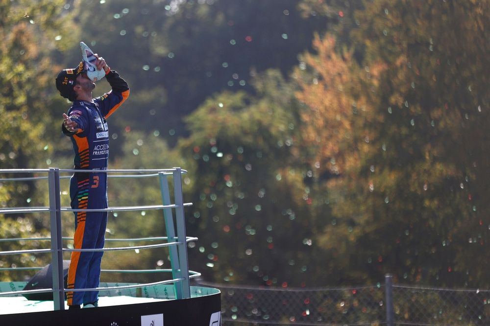 Daniel Ricciardo, McLaren, 1st position, performs a shoey on the podium
