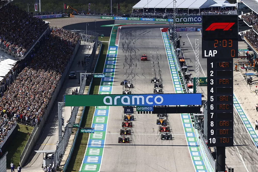 Max Verstappen, Red Bull Racing RB16B, and Lewis Hamilton, Mercedes W12, preapre to lead the field away at the start