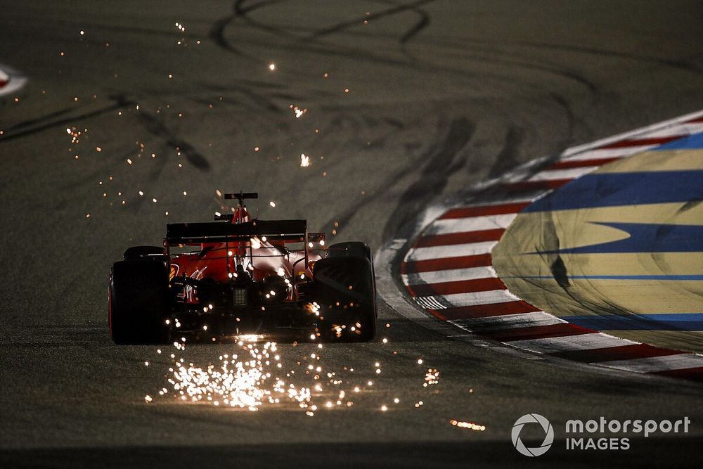 Sebastian Vettel, Ferrari SF1000, kicks up some sparks