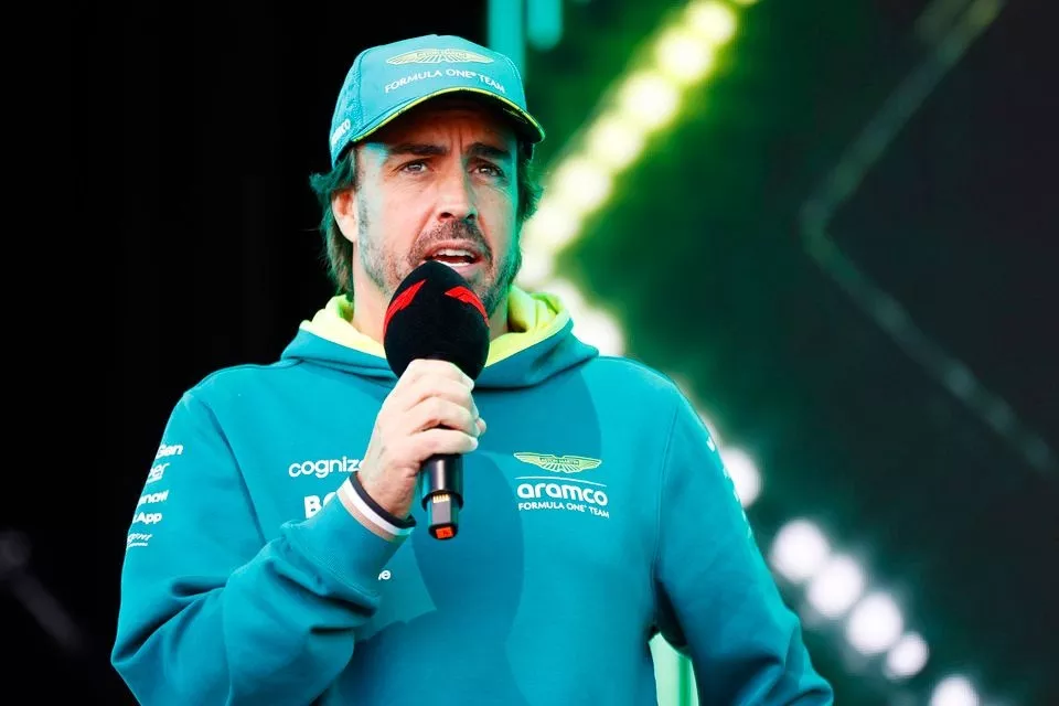 Fernando Alonso, Aston Martin F1 Team, is interviewed on stage at the fan forum