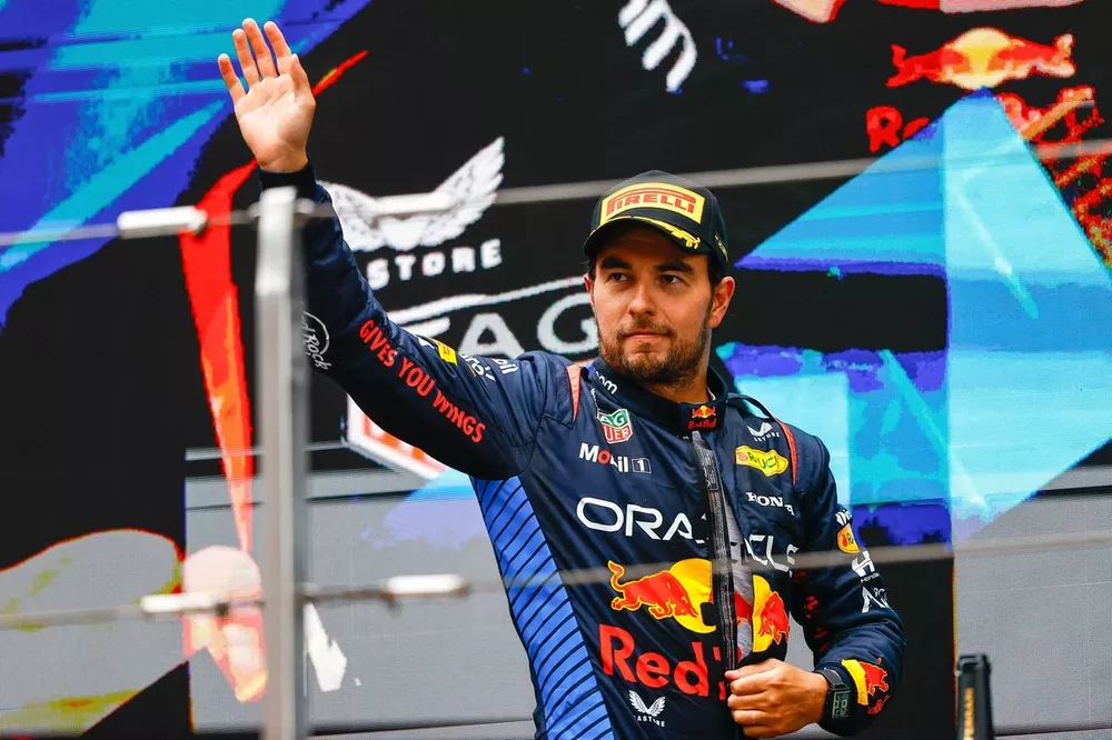 Sergio Perez, Red Bull Racing, 3rd position, waves from the podium