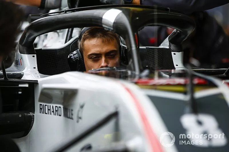 The Haas team conduct a practice pit stop with Formula 2 racer and development driver Louis Deletraz at the wheel