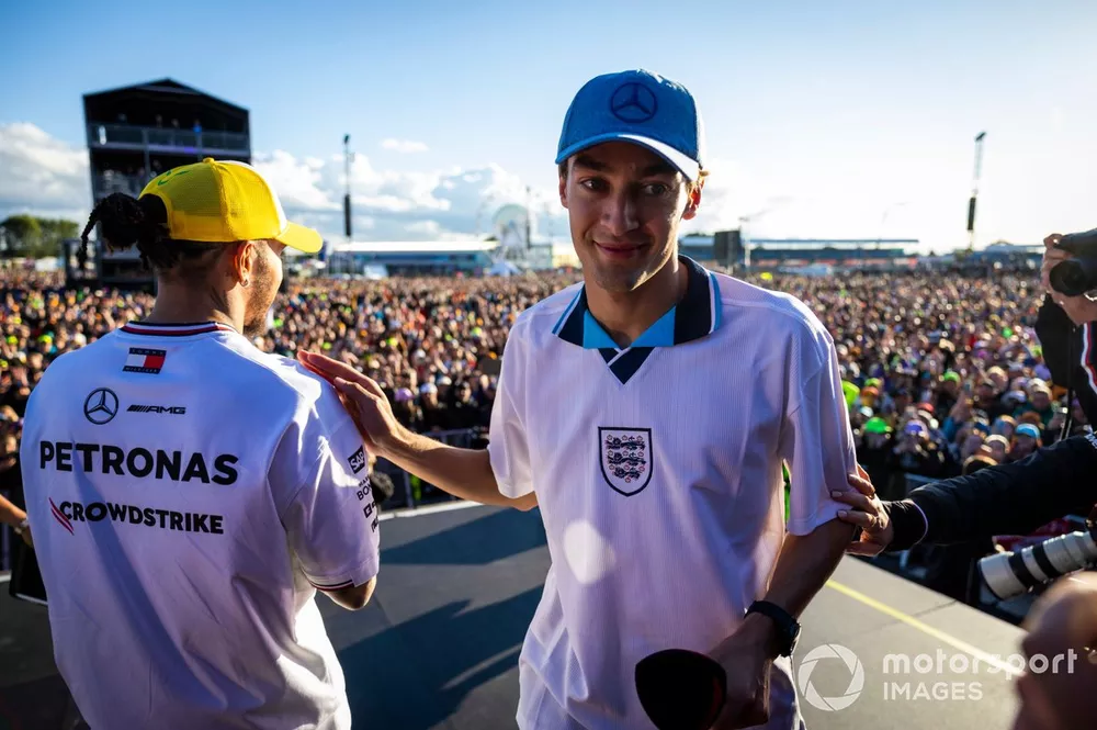 Sir Lewis Hamilton, Mercedes-AMG F1 Team, and George Russell, Mercedes-AMG F1 Team, greet fans in the fan zone