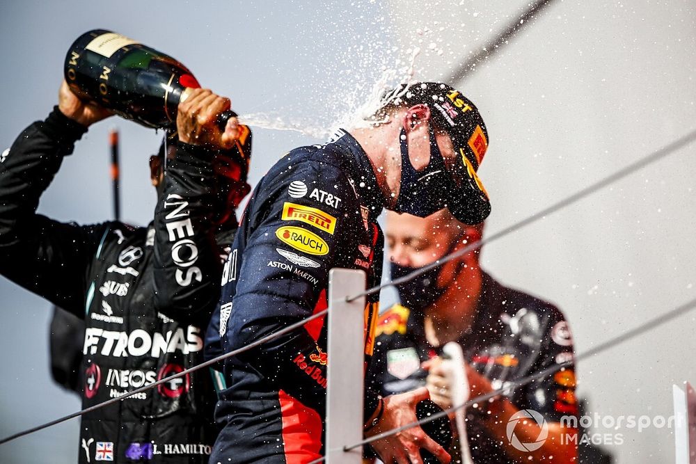 Race winner Max Verstappen, Red Bull Racing and Lewis Hamilton, Mercedes AMG F1 celebrate on the podium with the champagne