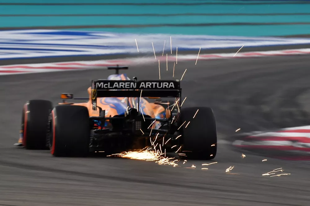 Daniel Ricciardo, McLaren MCL35M, kicks up sparks