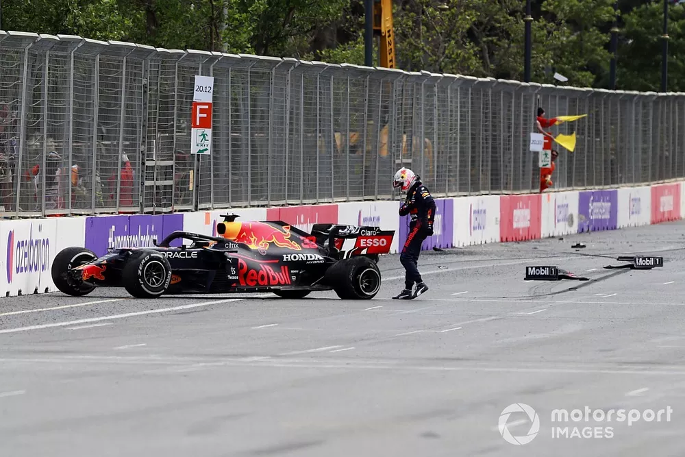 Max Verstappen, Red Bull Racing RB16B, kicks his car after crashing out