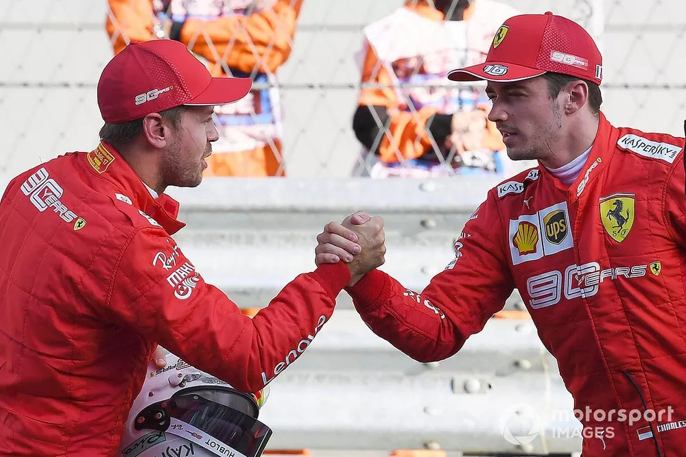 Sebastian Vettel, Ferrari, congratulates Charles Leclerc, Ferrari, on securing pole