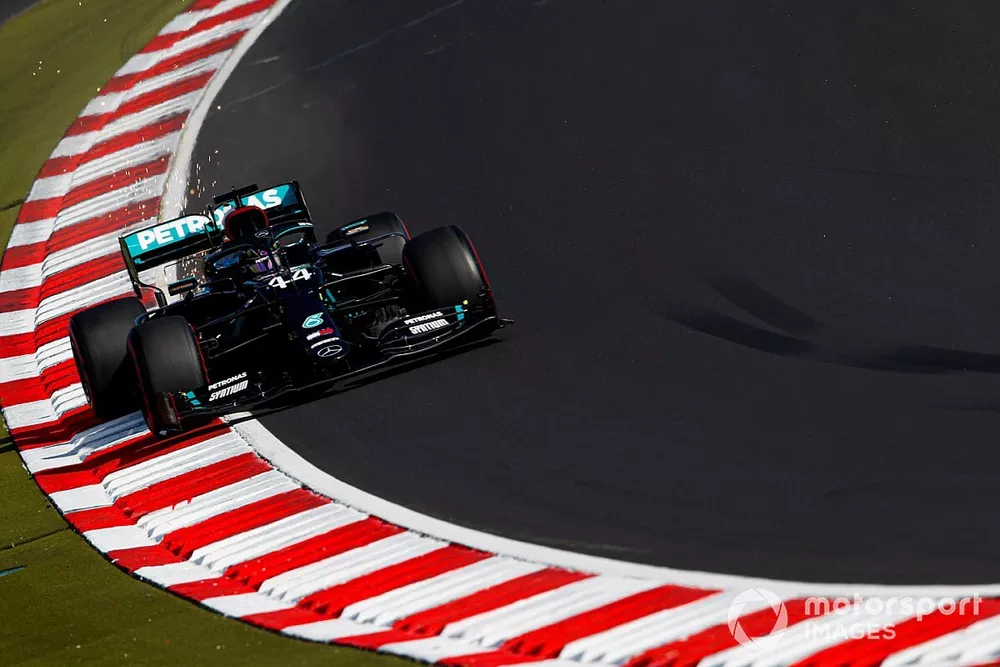 Lewis Hamilton, Mercedes F1 W11, kicks up some sparks