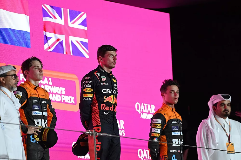 Oscar Piastri, McLaren, 2nd position, Max Verstappen, Red Bull Racing, 1st position, Lando Norris, McLaren, 3rd position, on the podium