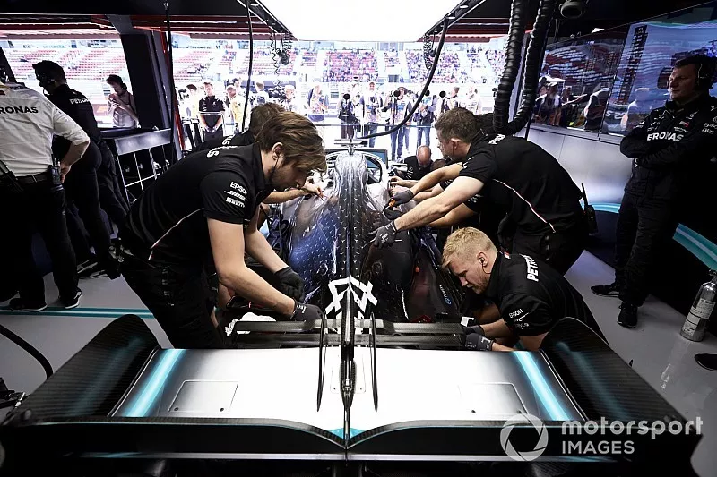 Mechanics at work on the car of Lewis Hamilton, Mercedes AMG F1 W10, in the garage