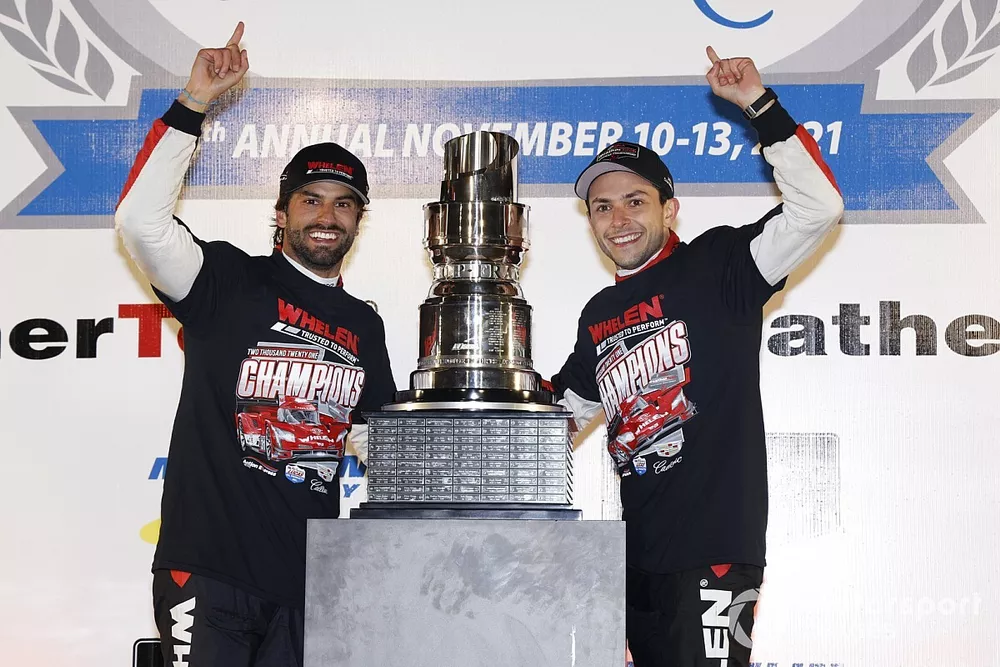 #31 Action Express Racing Cadillac DPi, DPi: Felipe Nasr, Pipo Derani  celebrate winning the championship on the podium