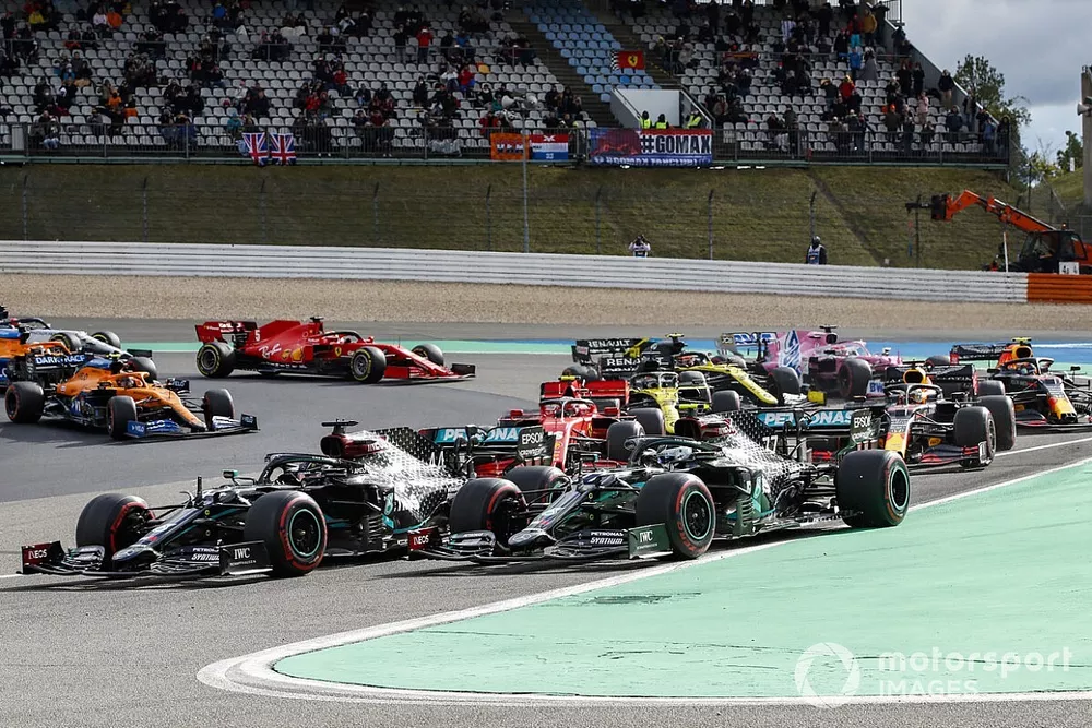 Valtteri Bottas, Mercedes F1 W11, and Lewis Hamilton, Mercedes F1 W11, lead the field away at the start