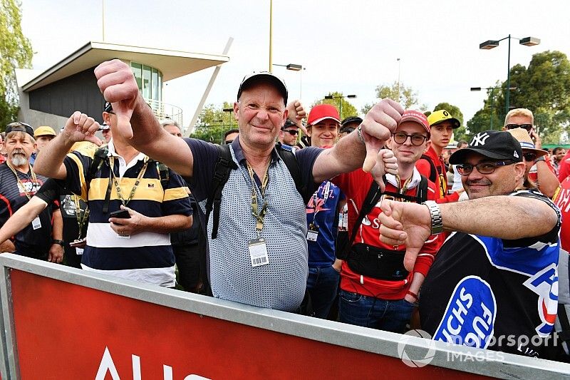 Fans queue at the closed gates