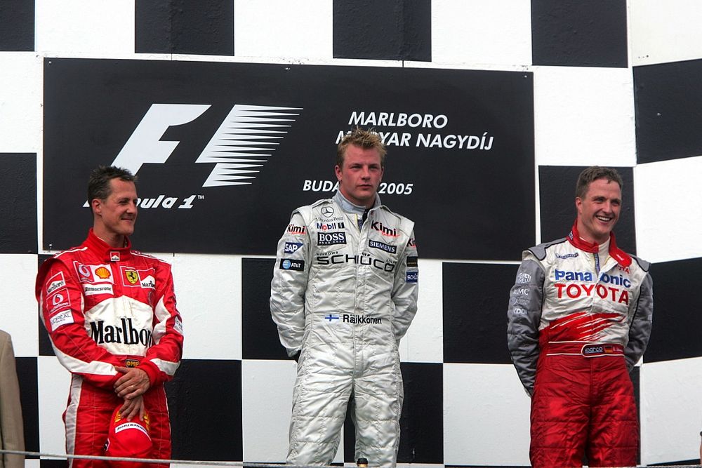 Podium: second place Michael Schumacher, Ferrari, race winner Kimi Raikkonen, McLaren, third place R