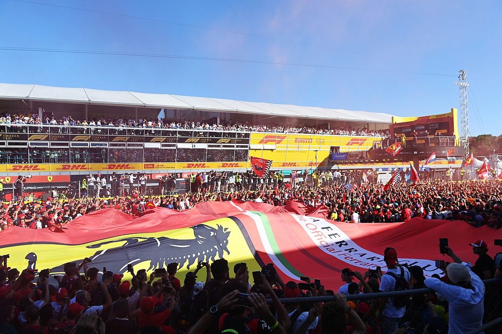 A huge Ferrari flag is unfurled at the podium ceremony