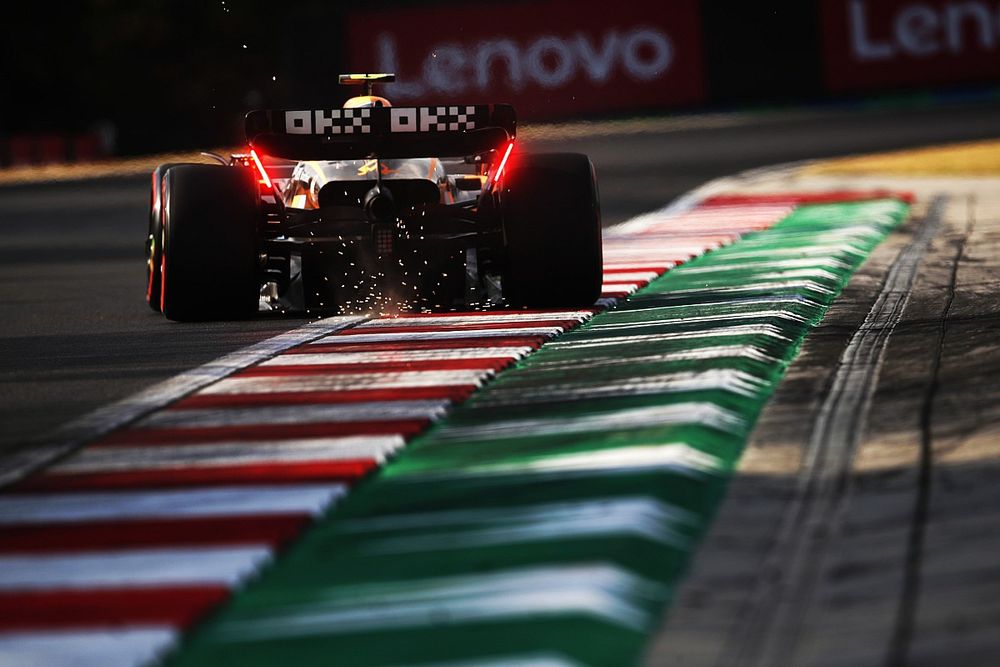 Lando Norris, McLaren MCL36, kicks up sparks
