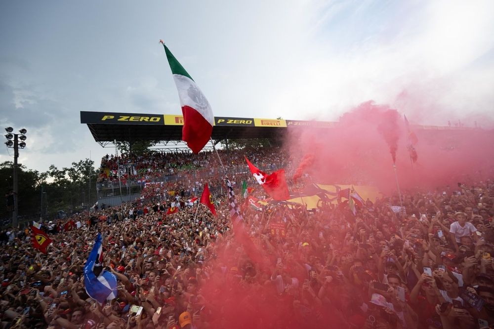 Ferrari fans fill the air with red at the podium ceremony