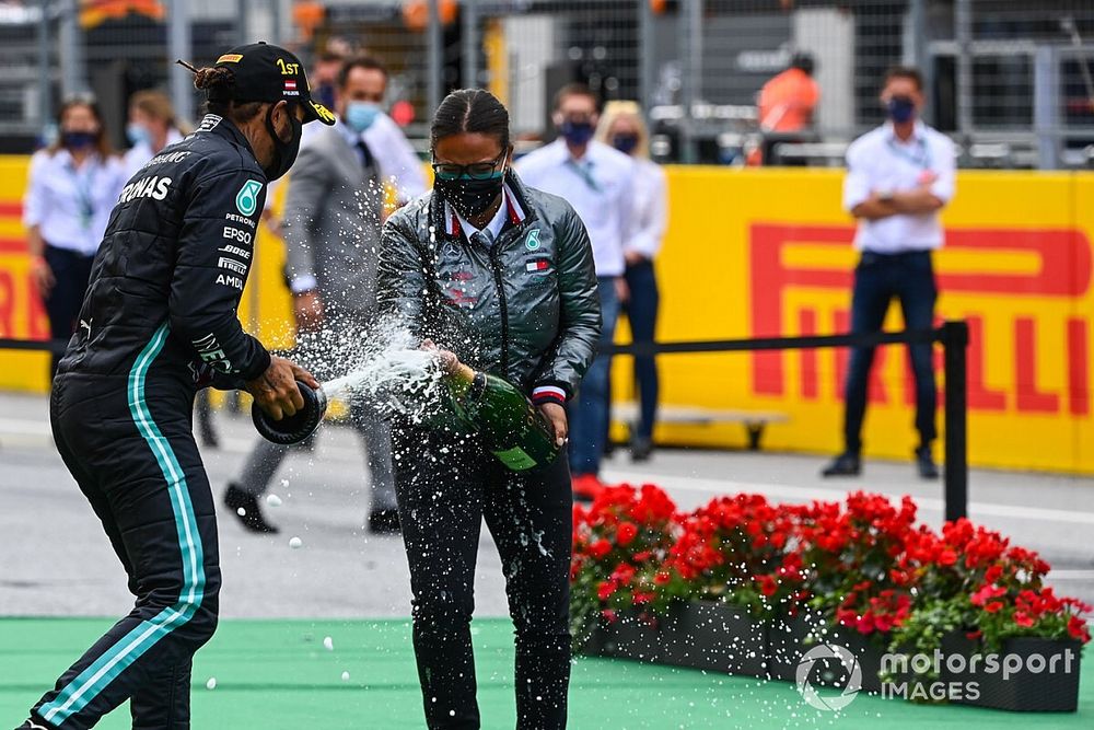 Lewis Hamilton, Mercedes-AMG Petronas F1, sprays champagne on the podium