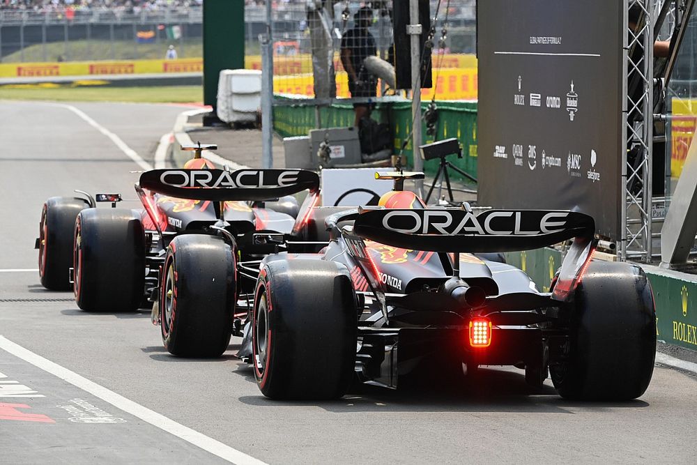 Max Verstappen, Red Bull Racing RB19, Sergio Perez, Red Bull Racing RB19, out of the pit lane