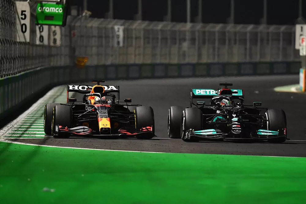 Max Verstappen, Red Bull Racing RB16B, battles with Lewis Hamilton, Mercedes W12