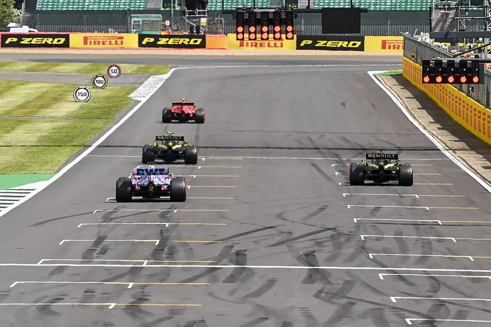 The drivers line up to practice their race start procedures at the end of the session