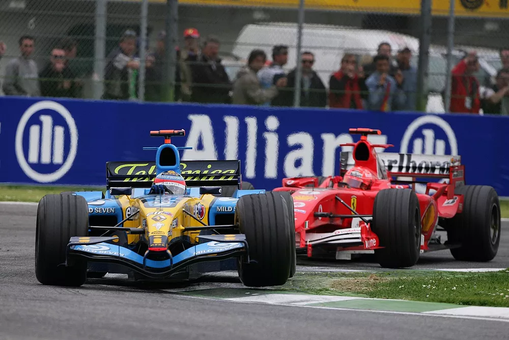 Fernando Alonso, Renault R25, leads Michael Schumacher, Ferrari F2005