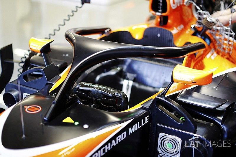 The halo device is fitted to the cockpit of a McLaren MCL32