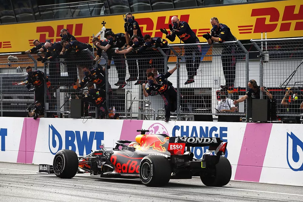 Max Verstappen, Red Bull Racing RB16B, crosses the line to win the race
