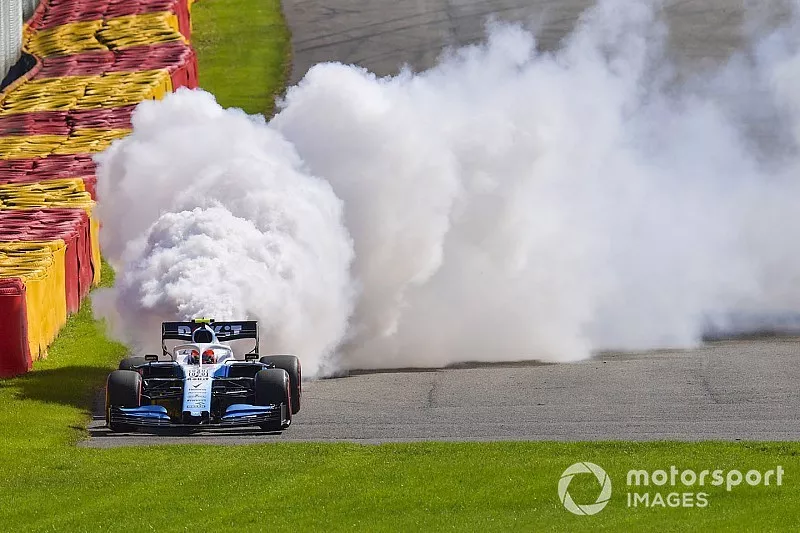 Robert Kubica, Williams FW42, parks up with technical issues and a large plume of smoke