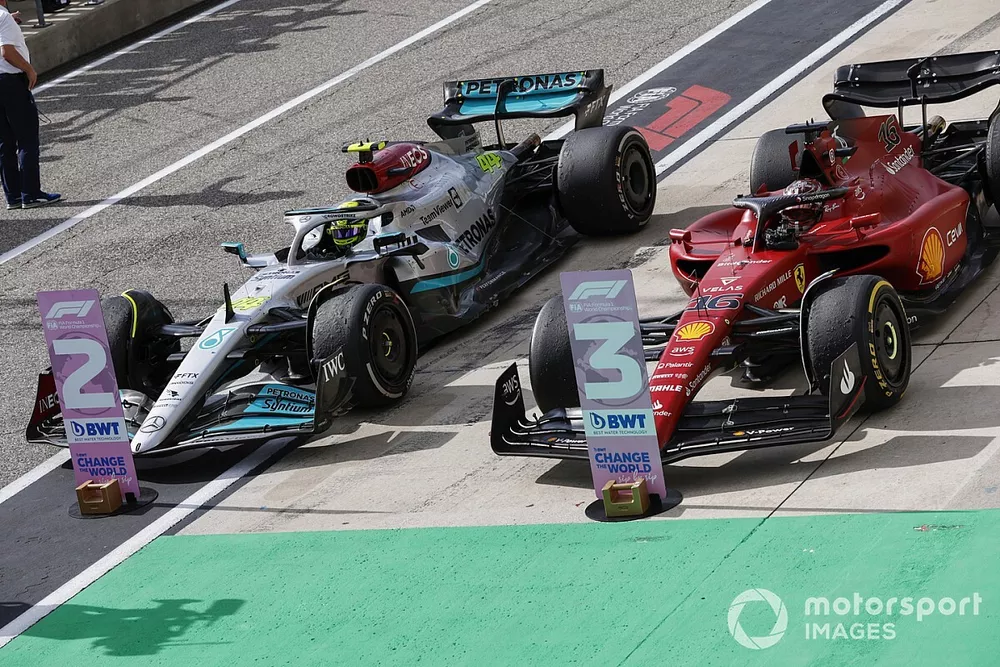 Lewis Hamilton, Mercedes W13, 2nd position, Charles Leclerc, Ferrari F1-75, 3rd position, arrive in Parc Ferme