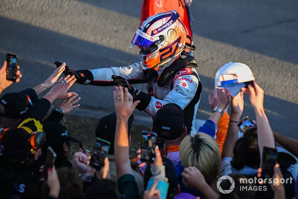 Nico Hulkenberg, Haas F1 Team, high fives some fans after stopping at the end of the race