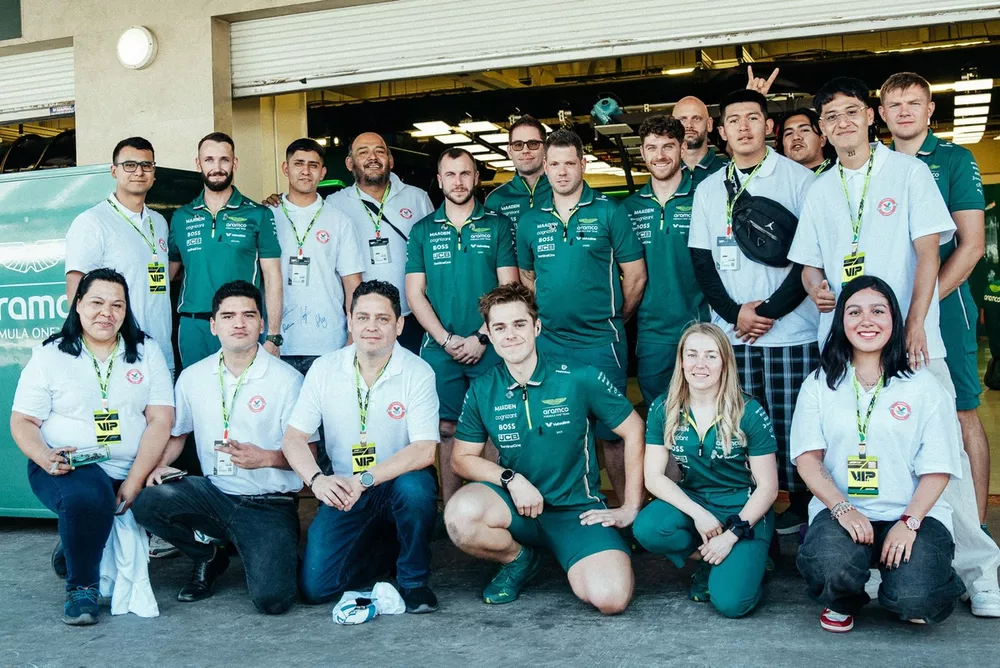Aston Martin F1 team members and Valvoline meet with students at the Escuela Mexicana de Electricidad