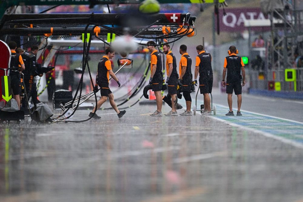 McLaren pit crew in the pit lane during FP1