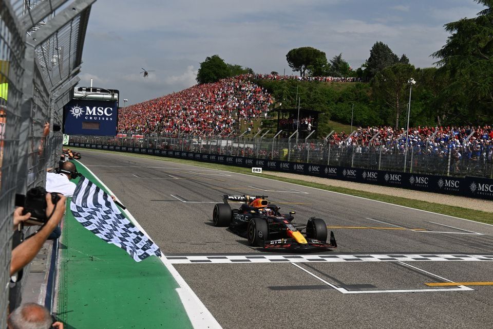 Max Verstappen, Red Bull Racing RB20, 1st position, takes the chequered flag