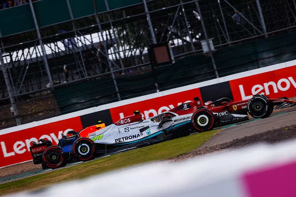 Lewis Hamilton, Mercedes W13, battles Charles Leclerc, Ferrari F1-75 and Sergio Perez, Red Bull Racing RB18