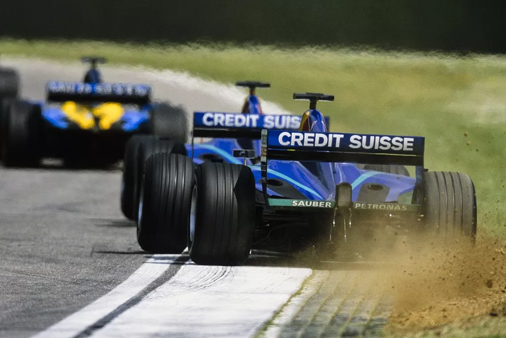 Felipe Massa, Sauber C21 Petronas, runs wide while following Nick Heidfeld, Sauber C21 Petronas