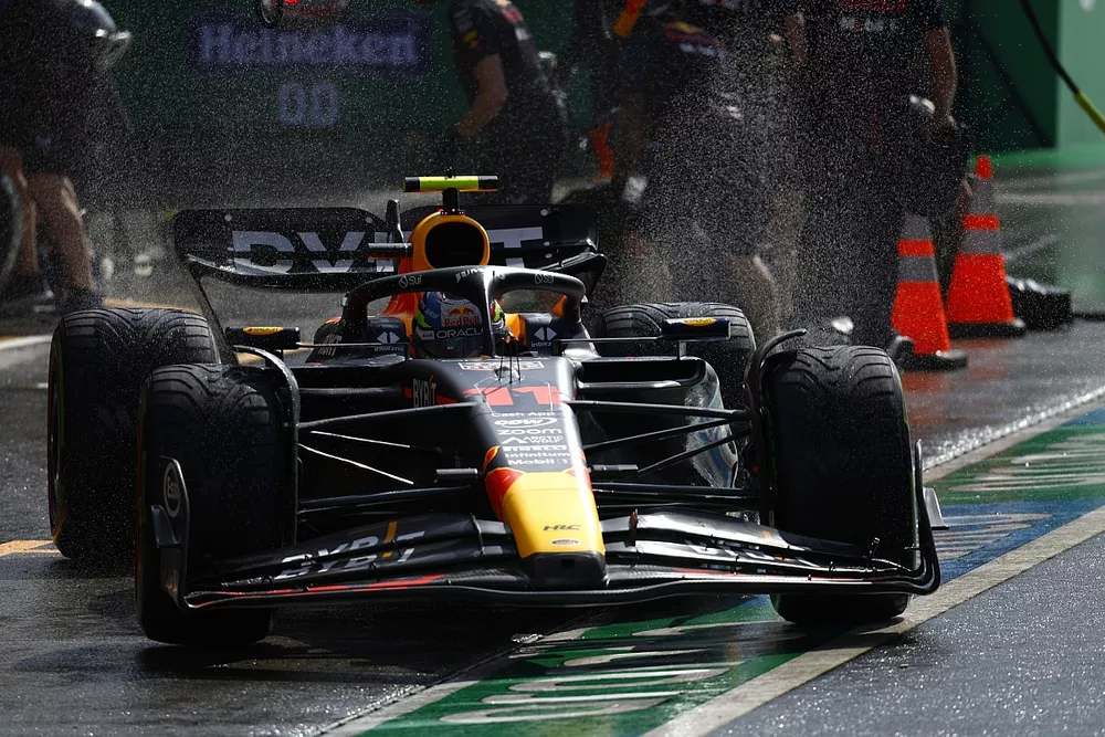 Sergio Perez, Red Bull Racing RB19, in the pits during Qualifying