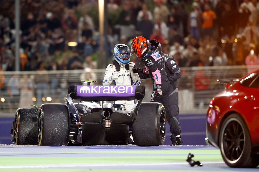 Esteban Ocon, Alpine A524, checks in on Franco Colapinto, Williams FW46, after they took each other out of the race