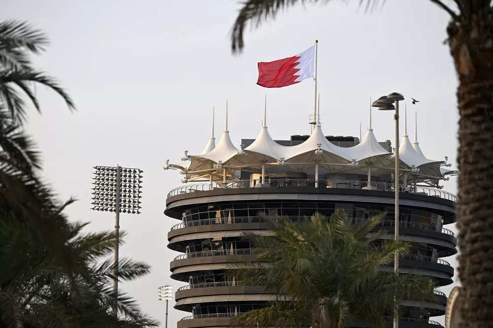 The Bahrain flag flies over the Sakhir Tower