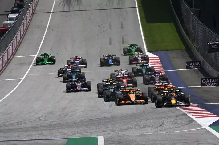 Max Verstappen, Red Bull Racing RB20, Lando Norris, McLaren MCL38, Oscar Piastri, McLaren MCL38, lead the field away for the start of the Sprint