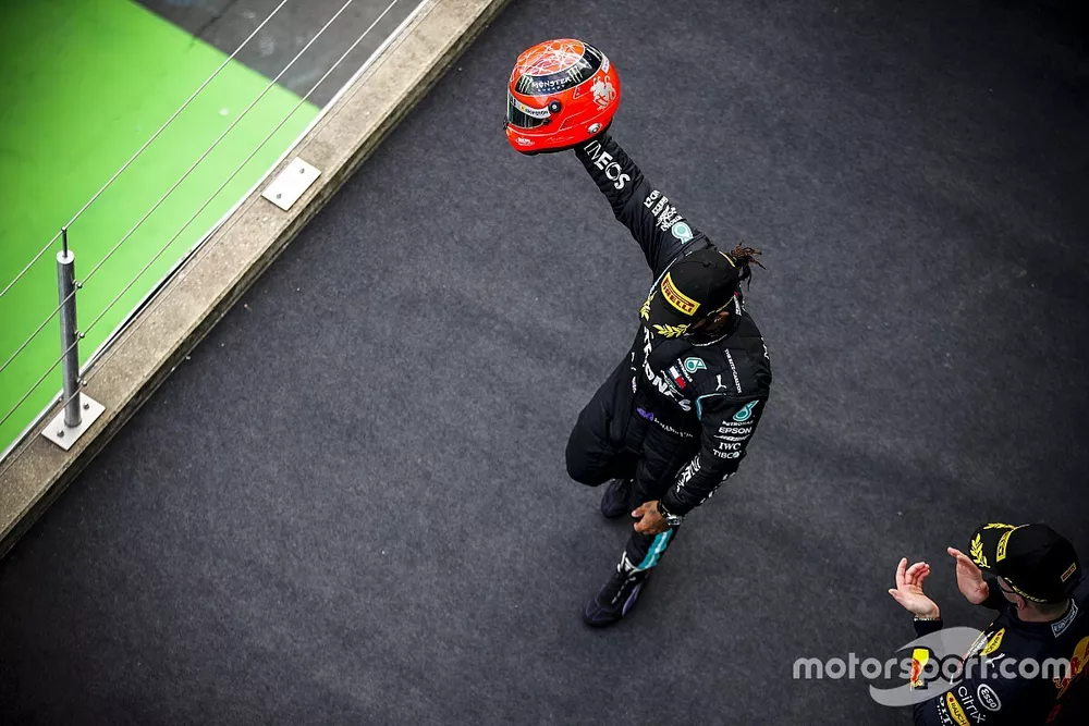Lewis Hamilton, Mercedes-AMG Petronas F1, 1st position, on the podium with the helmet of Michael Schumacher