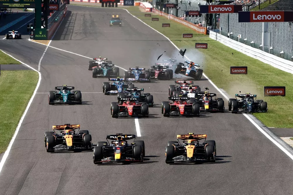 Valtteri Bottas, Alfa Romeo C43, collides with Alex Albon, Williams FW45, as Sergio Perez, Red Bull Racing RB19, squeezes Lewis Hamilton, Mercedes F1 W14, on to the grass and Max Verstappen, Red Bull Racing RB19, the field