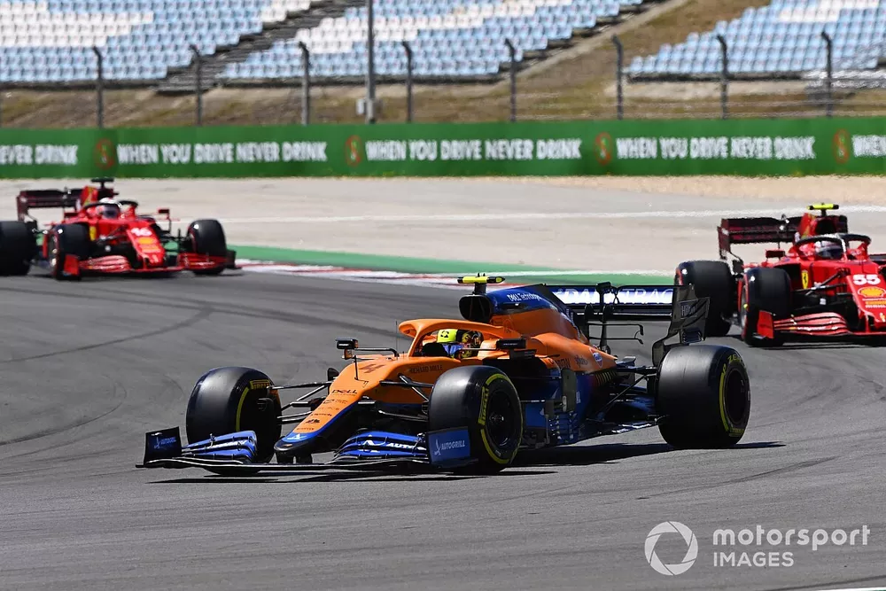 Lando Norris, McLaren MCL35M, Carlos Sainz Jr., Ferrari SF21, and Charles Leclerc, Ferrari SF21