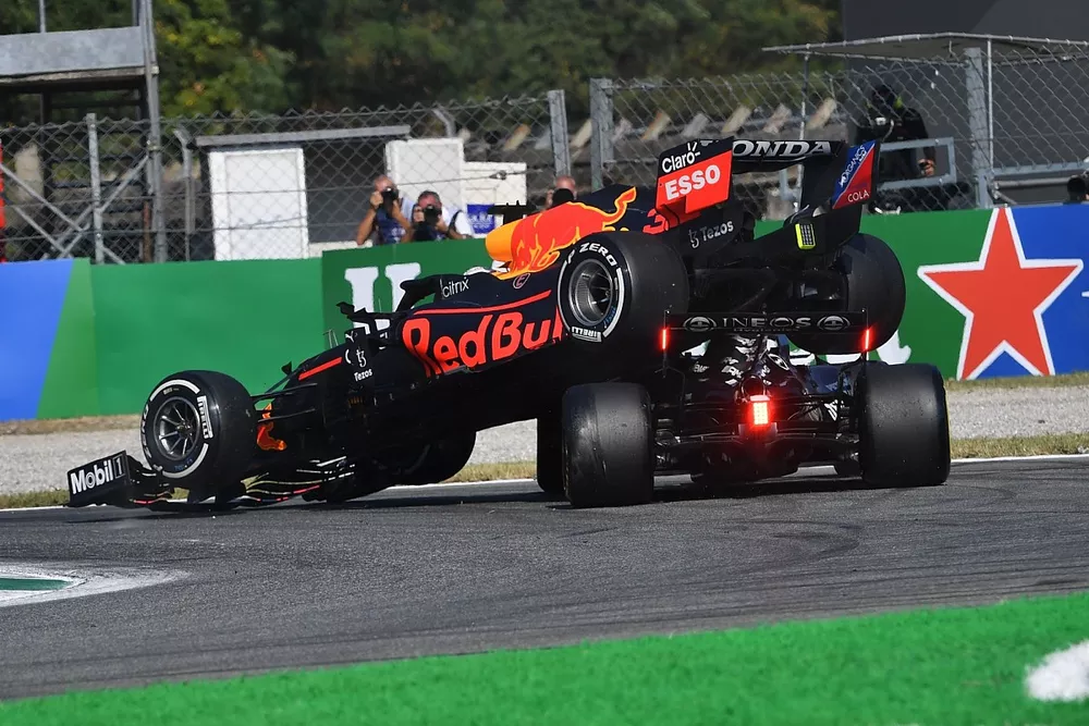 Max Verstappen, Red Bull Racing RB16B, and Lewis Hamilton, Mercedes W12, crash out
