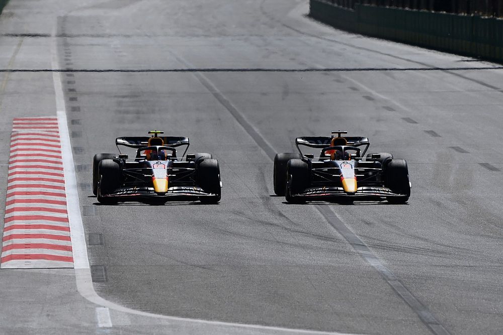 Max Verstappen, Red Bull Racing RB18, passes Sergio Perez, Red Bull Racing RB18
