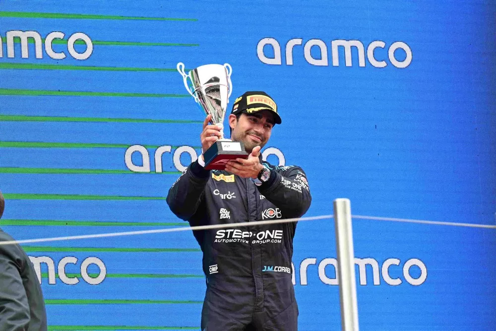 Juan Manuel Correa, Dams, 3rd position, lifts the trophy in celebration 